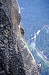 women climber on last pitch of lost arrow high above yosemite valley